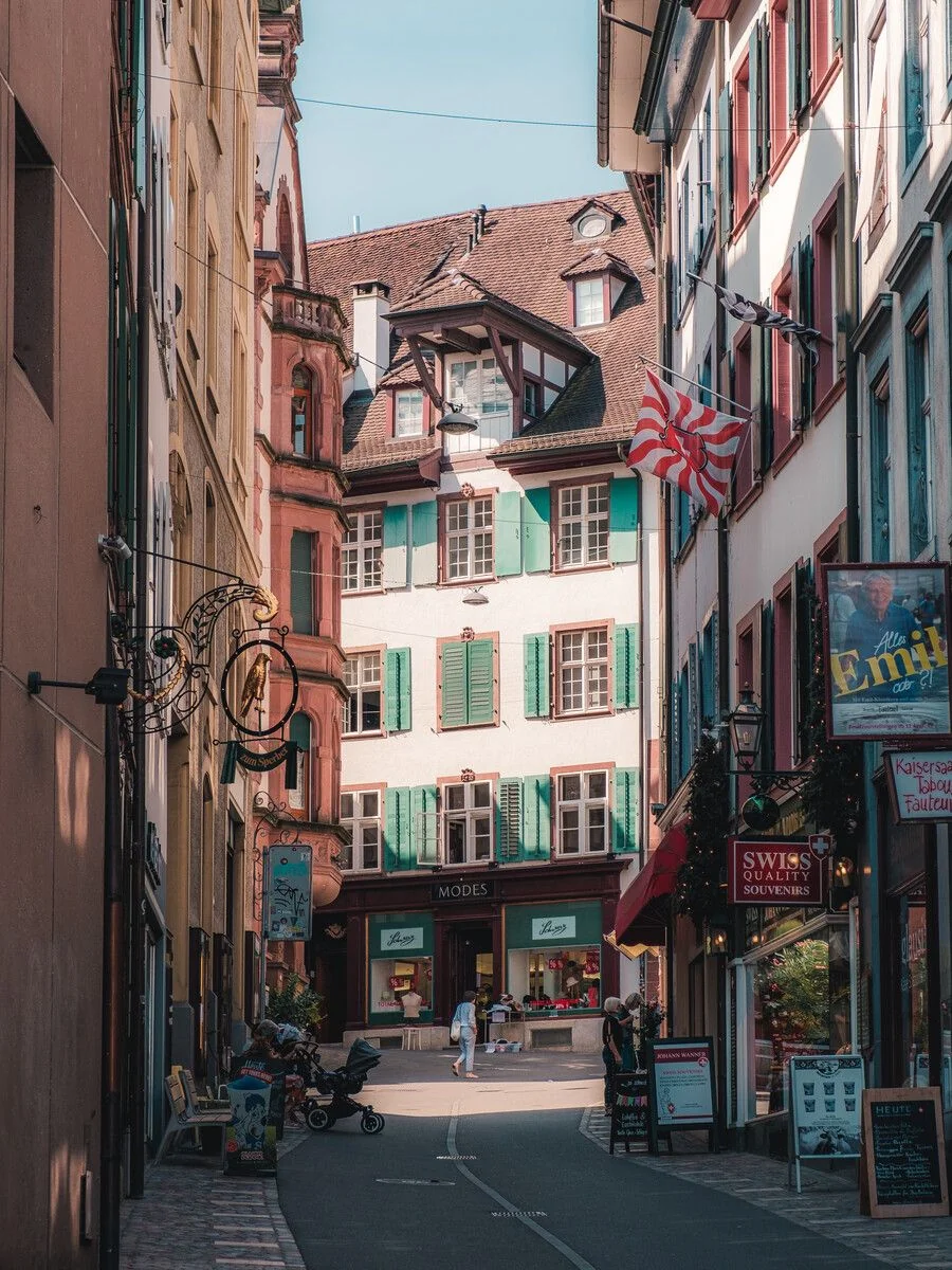 A quiet street in Basel Old Town with traditional facades and shutters