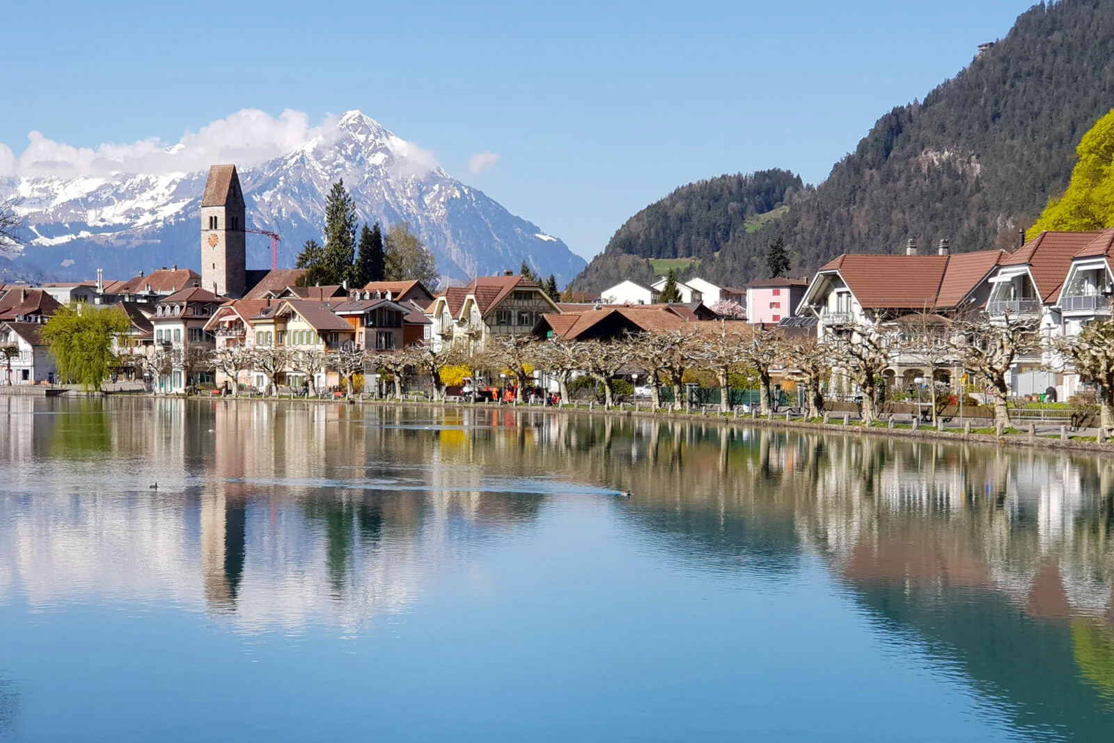 Interlaken and the Bernese Oberland reflected in the water beneath the Swiss Alps