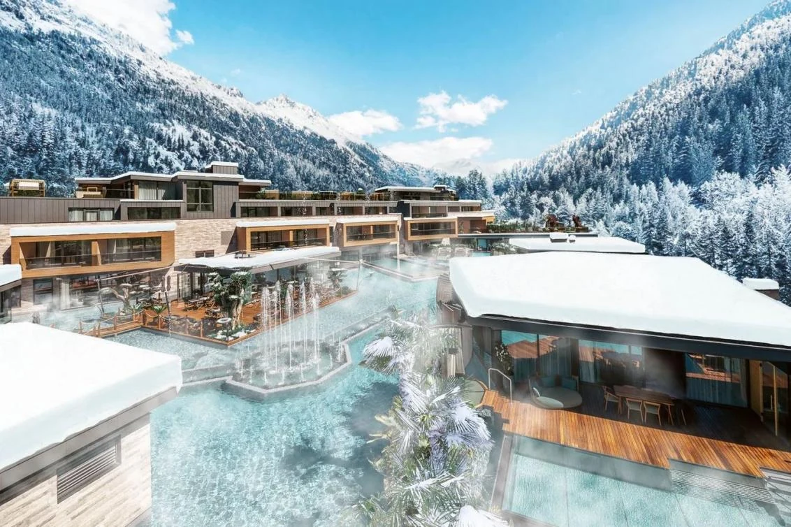 Quellenhof Passeier wellness resort with heated pools and snow-covered South Tyrol mountains