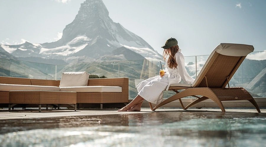 Summer pool terrace and hospitality experience with the Matterhorn near Riffelalp Resort 2222m