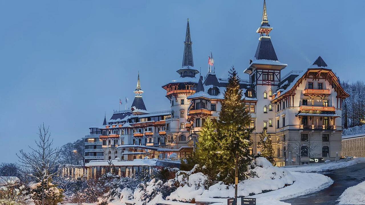 The Dolder Grand illuminated in winter above Zurich