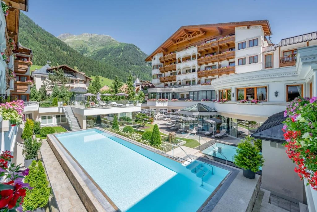 Trofana Royal Resort Ischgl with its pool, Alpine facade and Tyrolean mountain setting
